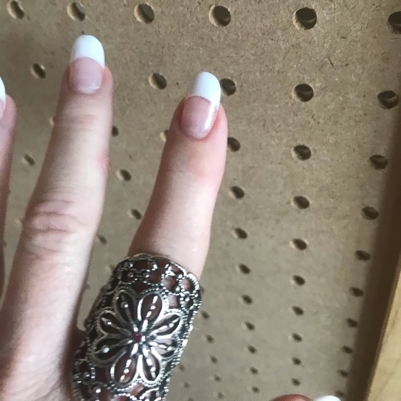Silver scroll ring w/tiny hot pink rhinestone.